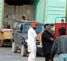 Though dry days were declared from 5 pm on Monday, Tribune lensman Pawan Sharma captured a view where cartons allegedly containing liquor were being unloaded from a truck into a vehicle (PB-08-BB-0786), carrying flags of the BJP and SAD (partly visible), at around 5.30 pm at Ranjit Nagar in Jalandhar.
