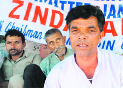 Members of the Doda Migrants Action Committee brief mediapersons about their pending demands in Jammu on Monday.