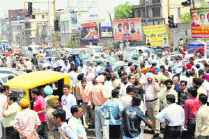 Traffic chaos at Jagraon bridge as the Congress supporters sat on a dharna on Monday in Ludhiana.