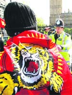 Tamils hold a protest outside Parliament in London on Monday.