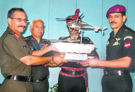 Lt Gen TK Sapru, GOC-in-C Western Command (left), presents the Western Command Flight Safety Trophy to an officer from 17th R&O Flight in Chandimandir on Tuesday.