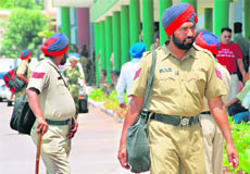 Policemen leave for their polling duty at their respective venues in Mohali on Tuesday.