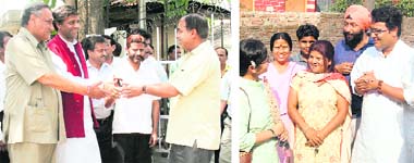 Vijay Bahuguna, Congress candidate from Tehri Garhwal, and Samajwadi Party general secretary Vinod Bharatwal go door to door to seek votes; and (right) Jaspal Rana, BJP candidate from Tehri Garhwal, with supporters in Dehradun on Tuesday. Tribune photos: Anil P Rawat