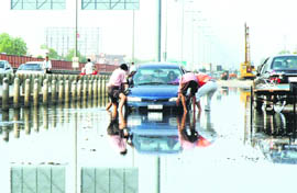 Scenes like this have become a common occurrence due to waterlogging in the service lane adjacent to the Delhi-Jaipur highway near Hero Honda Chowk in Gurgaon.