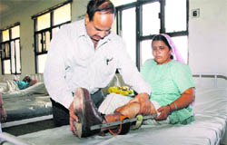 Dr SS Yadav examines a patient at a hospital in Mirpur village of Rewari.