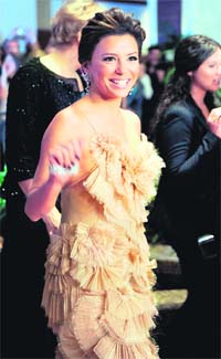 Brownie points: Actress Eva Longoria Parker waves to photographers on the red carpet for the recent annual black-tie White House Correspondents Dinner, at the Washington Hilton, in Washington. Reuters photo: Mike Theiler
