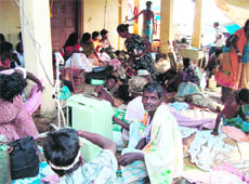 Injured Tamil civilians after a mortar attack at a makeshift hospital inside the No Fire Zone in northern Sri Lanka on Tuesday.