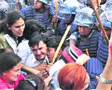 Medical workers affiliated with Maoists, who are against President Ram Baran Yadavs move of reinstating the army chief, scuffle with the police during a rally in Kathmandu on Tuesday.