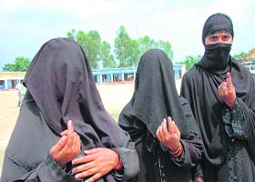 Burqa-clad Muslim women after casting their votes in Meowala village near Dehradun