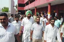 Jalandhar Cantonment MLA Jagbir Brar along with party workers at polling booth No 16 in Rabindra Day Boarding School in Jalandhar on Wednesday