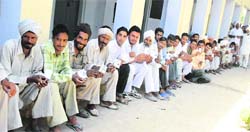 Villagers of Sidhwan wait of their turn to cast vote in Faridkot