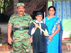 An undated picture supplied by the Sri Lankan Ministry of Defence shows LTTE chief Vellupillai Prabhakaran (left) standing along with his wife Mathivathani and son Balachandran. Sri Lankan army recently discovered a collection of photographs of the LTTE chief from a hideout in northern Sri Lanka. 