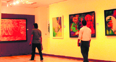 Paintings of Sarang Singla on display at an exhibition in Gurgaon.
