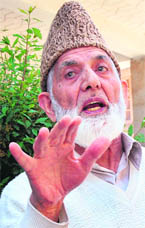 Hurriyat chairman Syed Ali Shah Gellani brings home a point during a press conference in Srinagar on Thursday.