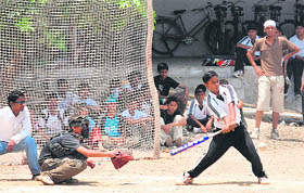 Players in action during a softball match being held at Ramgarhia Education Complex, Miller Ganj, Ludhiana, on Thursday.