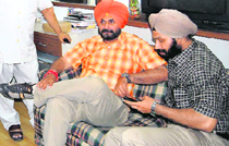 SAD-BJP candidate from Amritsar Navjot Singh Sidhu in a pensive mood at his residence in Amritsar on Thursday.