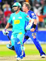 Warnes Master Stroke: Captain of Rajasthan Royals Shane Warne (R) celebrates after getting the wicket of Mumbai Indians Sachin Tendulkar during their match at The Kingsmead Stadium in Durban