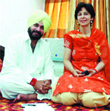 BJP candidate Navjot Singh Sidhu at his house with his wife Dr Navjot in Amritsar.