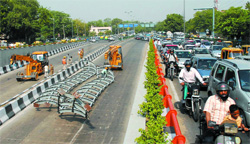 Vehiclular movement suffered after a crane broke the railings of Moolchand underpass in New Delhi on Friday.