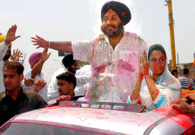 SAD candidate Harsimrat Kaur with party chief Sukhbir Badal.