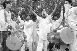 Workers celebrate victory of the Congress at the residence of former Punjab Chief Minister Capt Amarinder Singh in Patiala on Saturday.