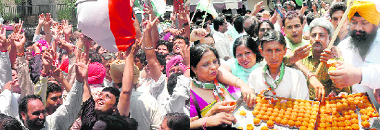 Congress supporters celebrate and distribute laddoos after Pawan Kumar Bansal’s victory in Chandigarh on Friday.
