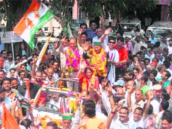 Former chief minister and senior Congress leader Virbhadra Singh responding to the crowd after he was declared elected at Mandi on Saturday. 