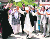 Congress supporters celebrate partys victory in the Lok Sabha elections in Srinagar on Saturday.