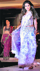 Bollywood actor Aarti Chhabaria walks the ramp to showcase the creation of designer Ramesh Dembla during a fashion show in Bangalore.