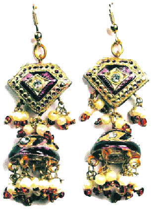 Enamel is glass fused to metal at high temperatures, and enamel jewellery is prepared by using this technique