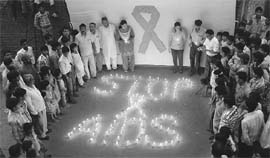 Members of the Nature Club of India, Panchkula, observe International AIDS Candlelight Memorial Day