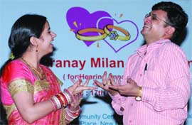 A couple suffering from auditory impairment interact in sign launguage during Pranay Milan-2009 in New Delhi on Sunday.