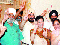 Relatives of Prime Minister Manmohan Singh celebrate the victory of the Congress in Lok Sabha poll in Amritsar on Sunday.