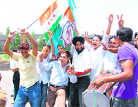 NSUI members celebrate the UPA victory in Jammu on Sunday.