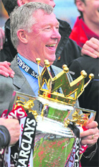 Alex Ferguson with the Premiership trophy after the game against Arsenal at Old Trafford on Saturday.