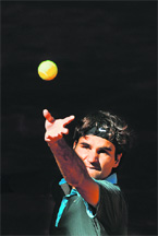 Roger Federer serves to Rafael Nadal during the final of the Madrid Open on Sunday.