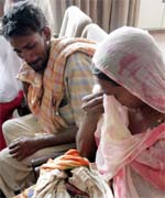 The family members of the woman wait to meet the SP (Headquarters) in Bathinda with the dead twins of the woman labourer who suffered a miscarriage after being allegedly assaulted by a brick kiln owner.