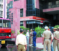 The Delhi police personnel outside ICICI Bank branch at Narmada House, K.G. Marg in New Delhi on Monday.