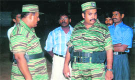 An undated file picture supplied by the Sri Lankan Ministry of Defence shows LTTE leader V. Prabhakaran (left) and his eldest son Charles Anthony from a collection of photographs that government soldiers said were discovered recently in a hideout in northern Sri Lanka.