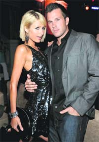 Actor Paris Hilton (L) with her boyfriend Doug Reinhardt. 