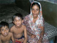A woman suffering from chickenpox with her kids in Moga on Tuesday.