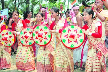 A cultural troupe from Assam participates in a road show in Dehradun on Tuesday.