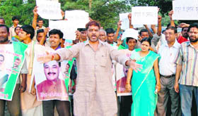 Congress workers and members of some social organisations hold a protest against Chief Minister BC Khanduri in Haridwar on Tuesday.