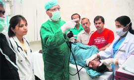 Dr Bharat Bhusan Gupta treats a patient in Jammu