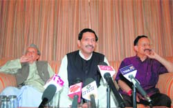 State BJP chief Bachi Singh Rawat (centre) addresses mediapersons at Dehradun on Wednesday. Sitting alongside are Chief Minister BC Khanduri (right) and former Chief Minister Bhagat Singh Koshiyari.