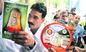 Pilgrims stand in a queue for registration for the Amarnath yatra in Jammu on Wednesday.