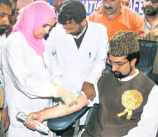 APHC chairman Mirwaiz Umar Farooq donates blood in Srinagar on Wednesday, on the eve of the 19th death anniversary of his father Mirwaiz Molvi Mohmmad Farooq.