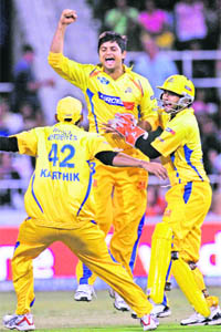 Chennai Super Kings Suresh Raina (C) along with his team mates, celebrates the dismissal of Kings XIs Yuvraj Singh during their match in Durban on Wedenesday.