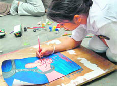 An NCC cadet during a painting competition at Sukhna Lake in Chandigarh on Thursday.