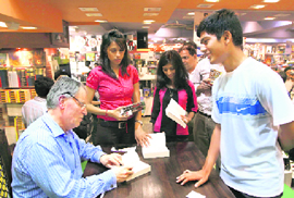 Novelist Lord Jeffrey Archer with his fans at a book store in Gurgaon.